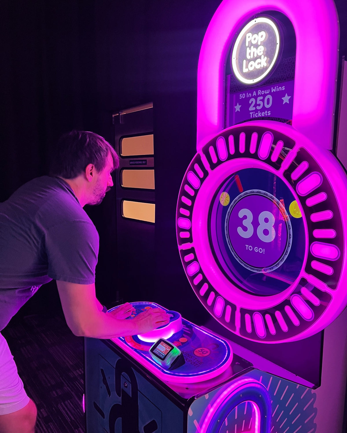 Pop the Lock arcade machine with circular LED lock display, fast-paced button timing gameplay, and bright cabinet graphics
