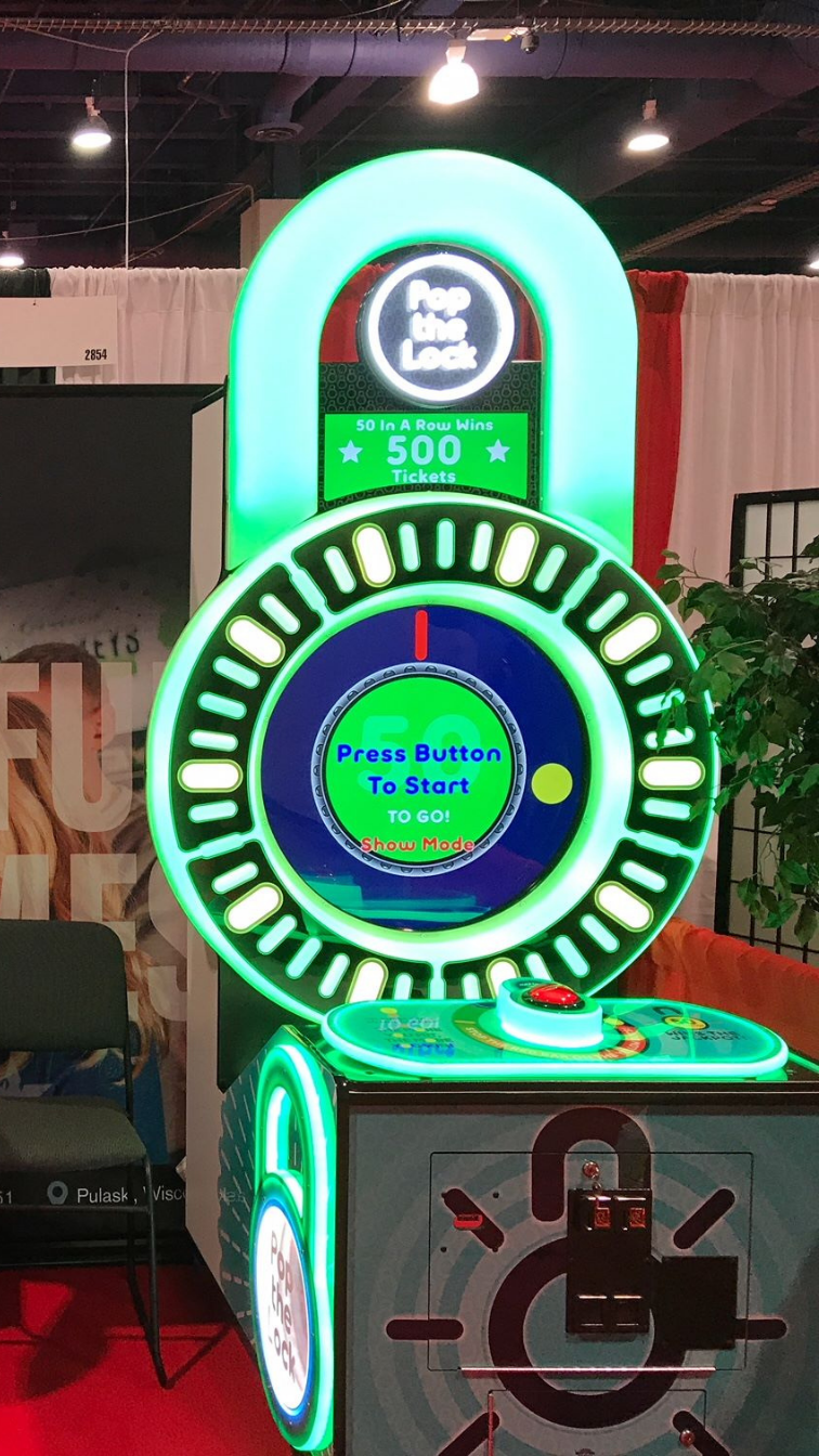 Pop the Lock arcade machine with circular LED lock display, fast-paced button timing gameplay, and bright cabinet graphics
