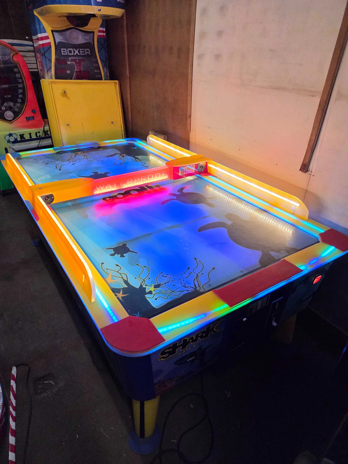 Shark Air Hockey 8ft table with illuminated waterproof playfield and large arcade design."