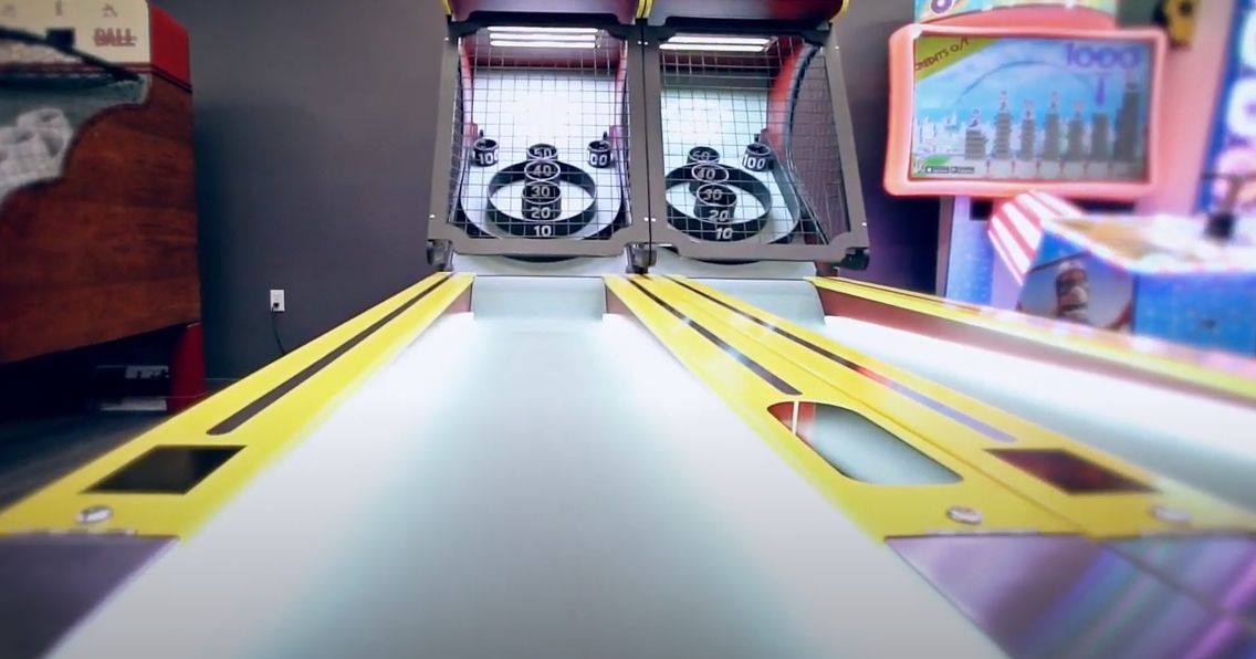 Skee-Ball Classic arcade game with wooden alley roller lane, retro scoring rings, and nostalgic carnival-style design