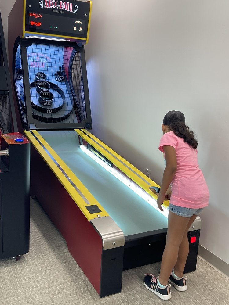 Skee-Ball Classic arcade game with wooden alley roller lane, retro scoring rings, and nostalgic carnival-style design