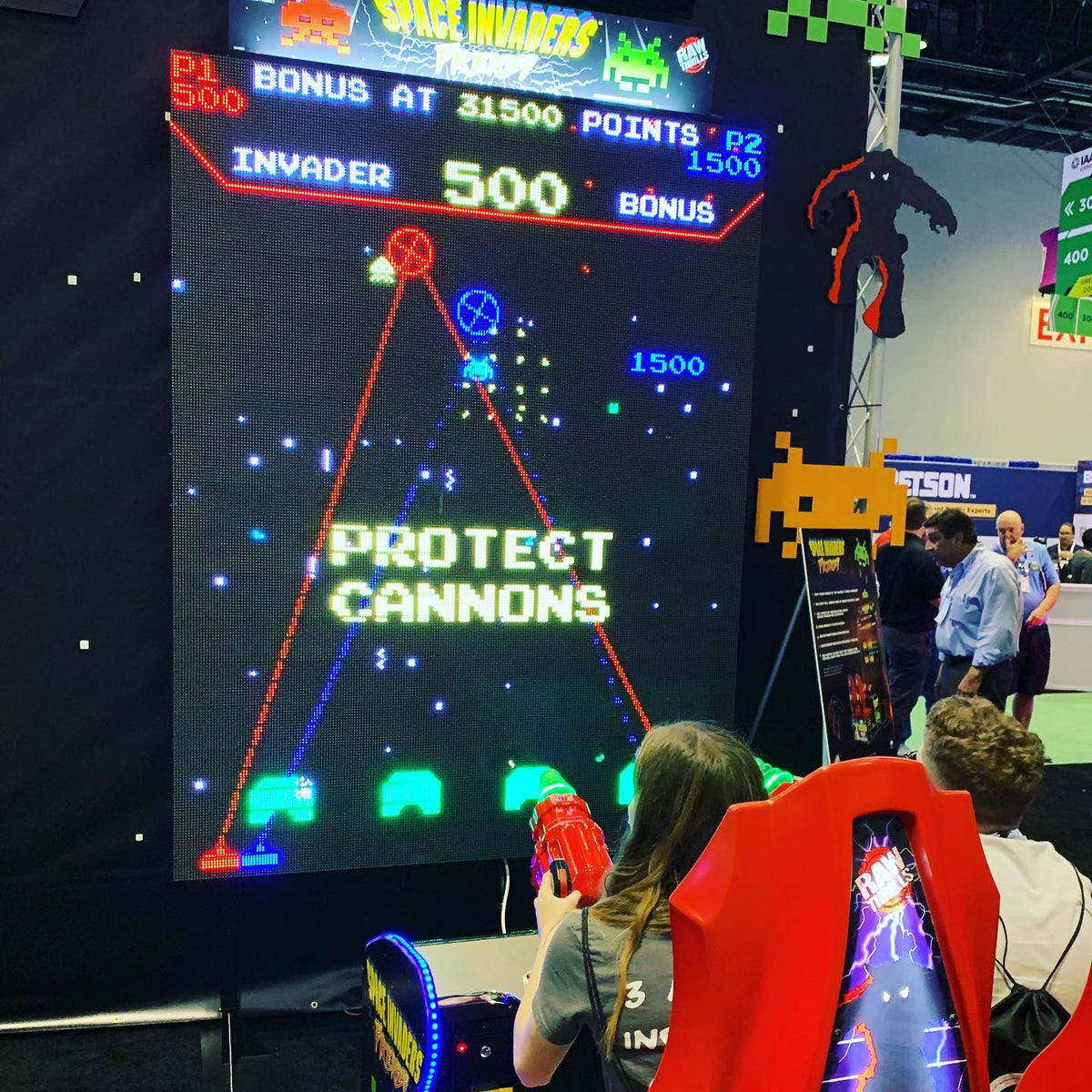 Space Invaders Frenzy arcade machine with giant 109-inch LED screen and 2-player ticket redemption gameplay.