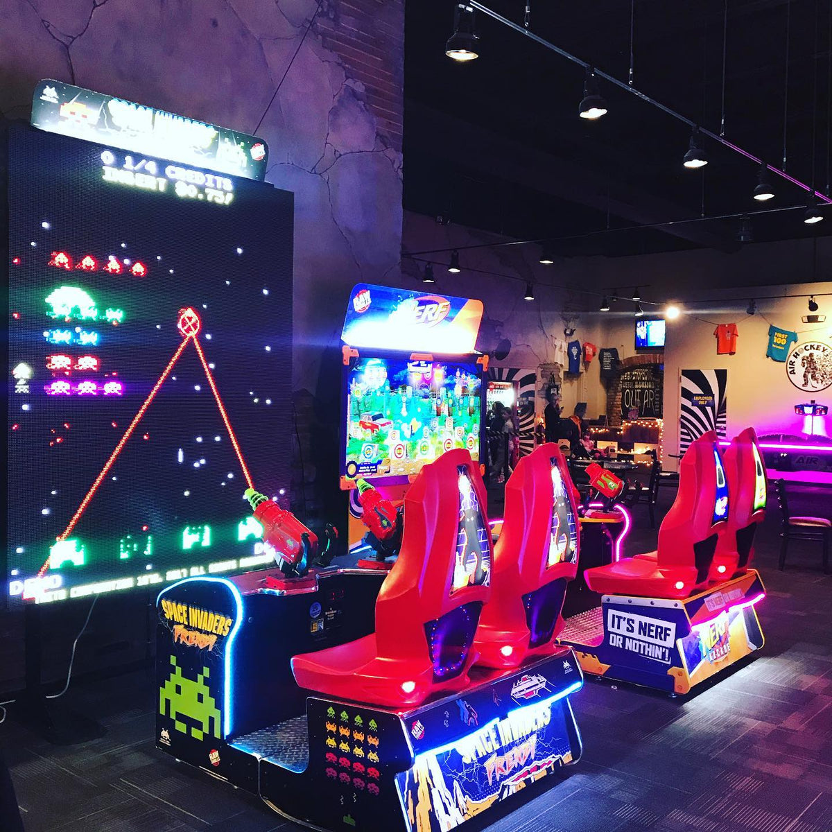 Space Invaders Frenzy arcade machine with giant 109-inch LED screen and 2-player ticket redemption gameplay.