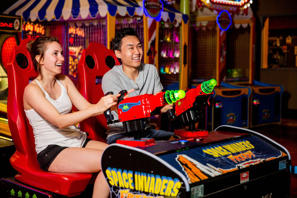 Space Invaders Frenzy arcade machine with giant 109-inch LED screen and 2-player ticket redemption gameplay.