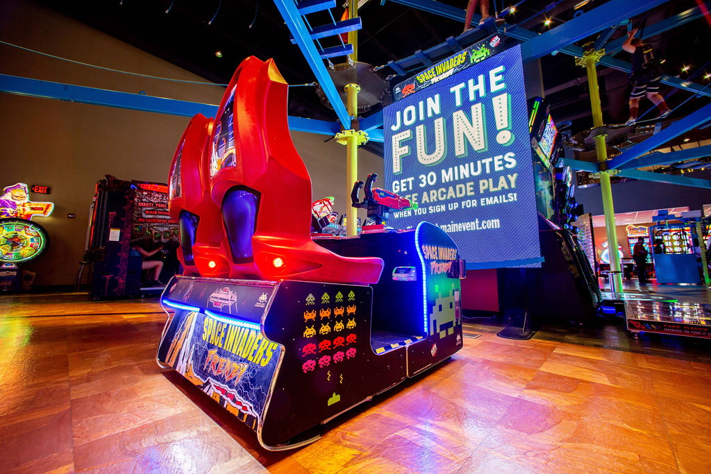 Space Invaders Frenzy arcade machine with giant 109-inch LED screen and 2-player ticket redemption gameplay.