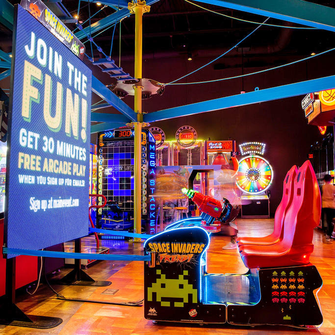 Space Invaders Frenzy arcade machine with giant 109-inch LED screen and 2-player ticket redemption gameplay.