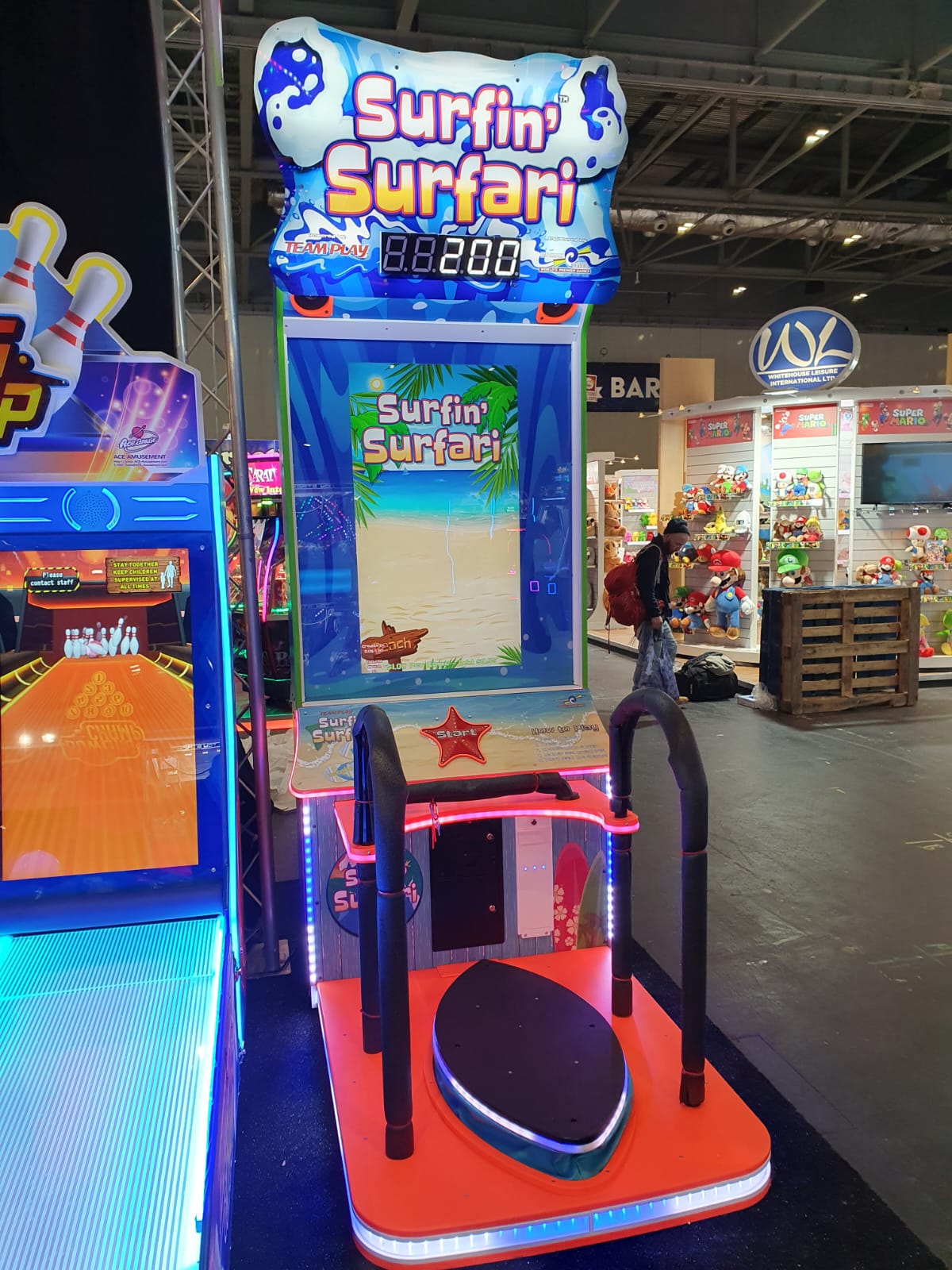 Surfin’ Surfari motion surfboard arcade machine with ticket redemption gameplay and immersive surfing simulation