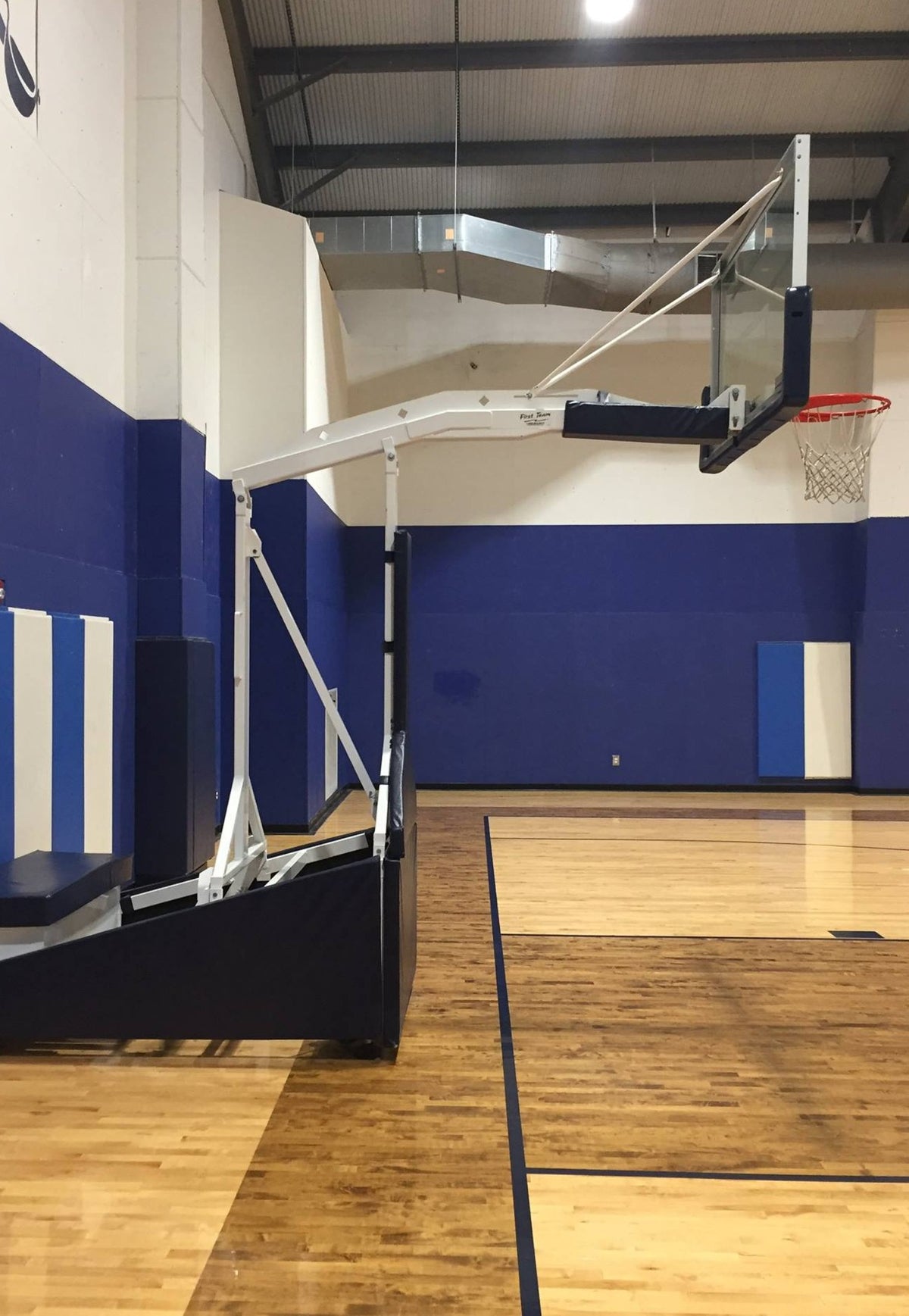 Tempest Triumph portable basketball goal with 72-inch tempered glass backboard and 66-inch extension