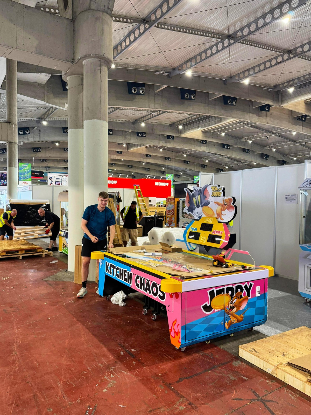 Tom & Jerry Kitchen Chaos air hockey table with multi-puck arcade action and cartoon-themed LED cabinet.