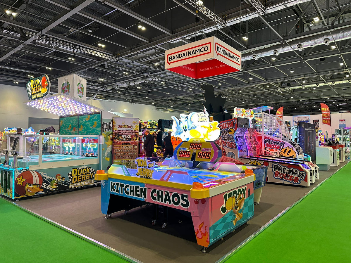 Tom & Jerry Kitchen Chaos air hockey table with multi-puck arcade action and cartoon-themed LED cabinet.
