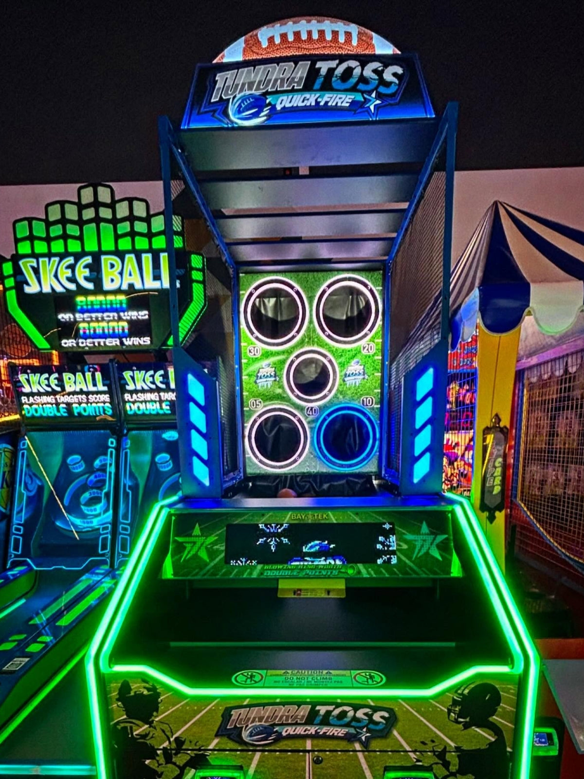 Tundra Toss Quick Fire football toss arcade machine with timed skill gameplay and compact wall cabinet.